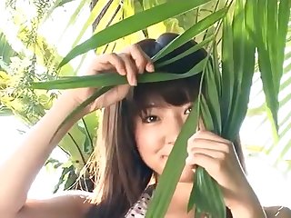 Slender Asian with sexy small tits teases solo outdoors